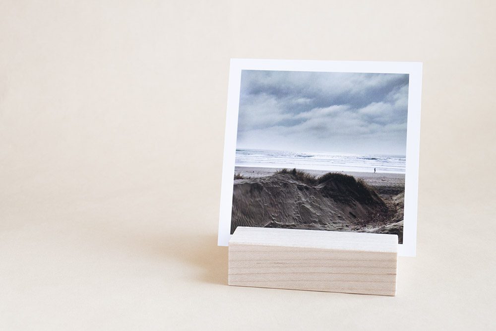 Square photo print of beach in wooden block holder